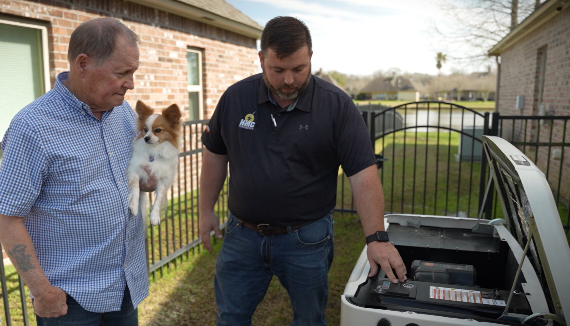HMC technician reviewing generator safety with a homeowner.